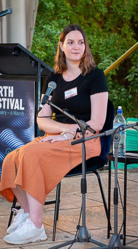 Bianca Breen in front of the microphone at the business of being a writer