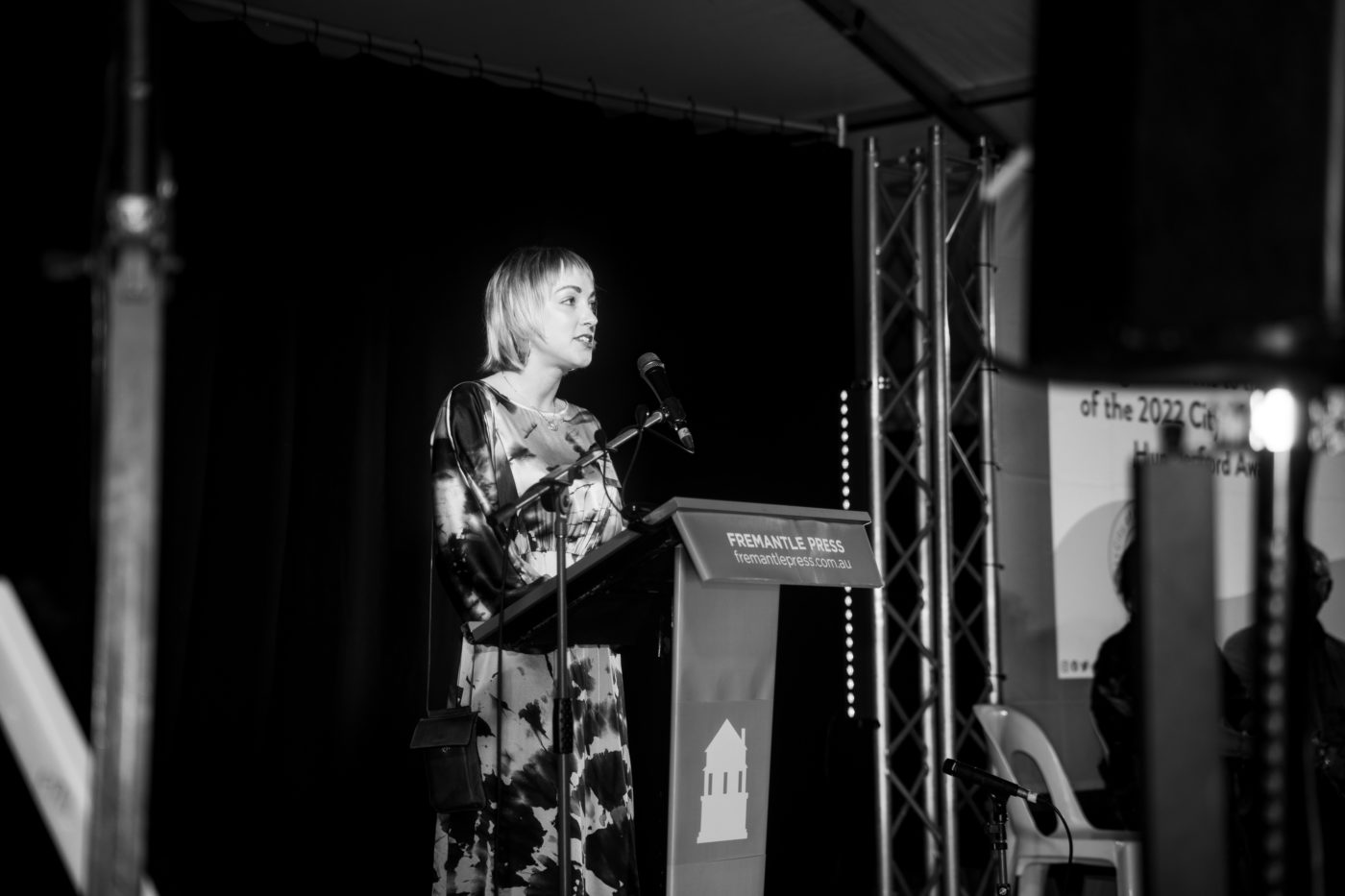 Hungerford Award winner Molly Schmidt on stage giving a speech